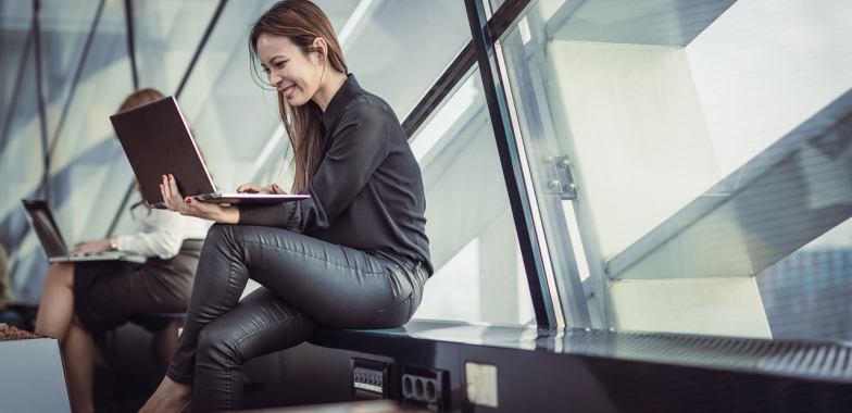 Woman with laptop at airport