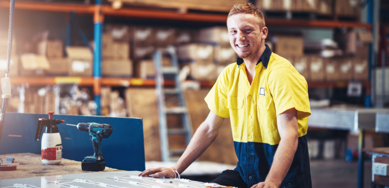 Smiling man in warehouse