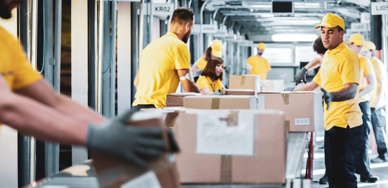People working on a conveyor belt of parcels