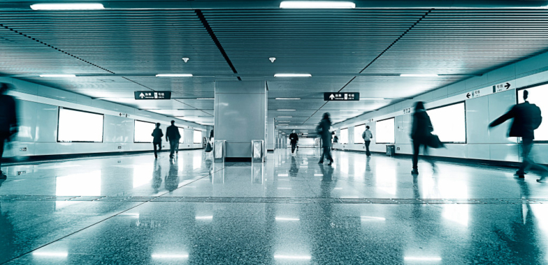 Modern train platform with few commuters