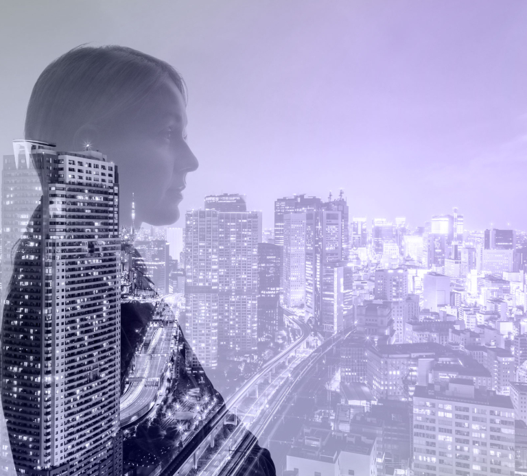 Vantaset woman looking over cityscape