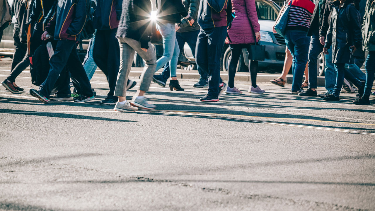 Image of people crossing the street, legs only
